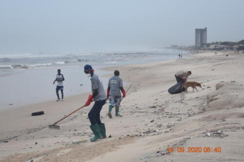 HE Gregory Andrews busily picking plastic debris during the World Cleanup Day at the Laboma Beach Accra